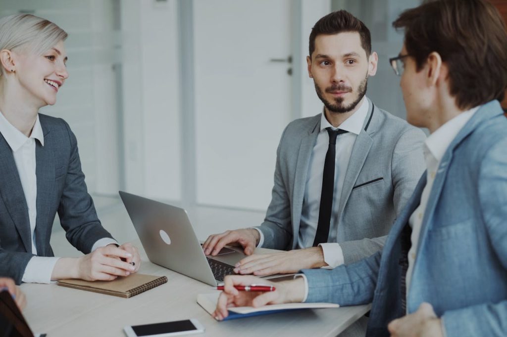 Professionals collaborating in a modern office on centralised membership administration